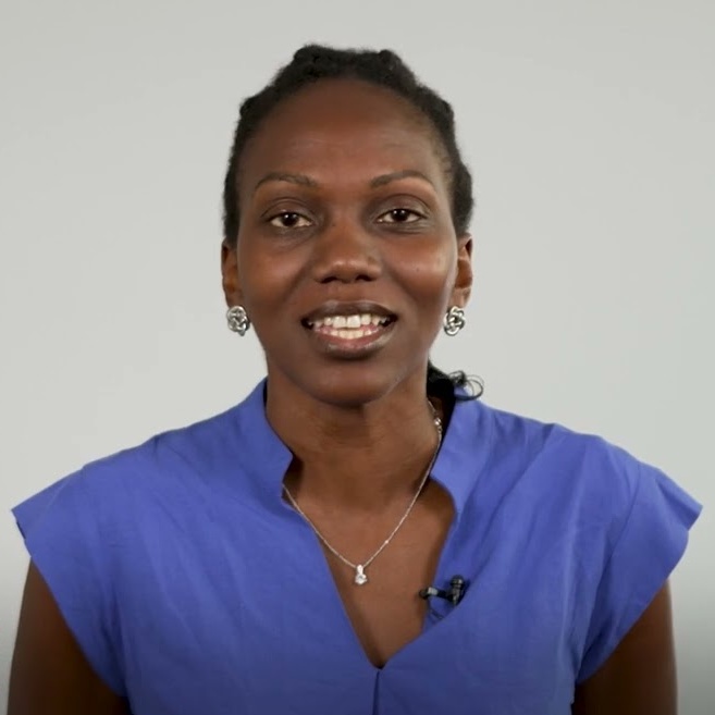 Kozel Williams - Fresh Thinking Labs Woman in a royal blue blouse speaks to the camera, with a small microphone clipped to her top.